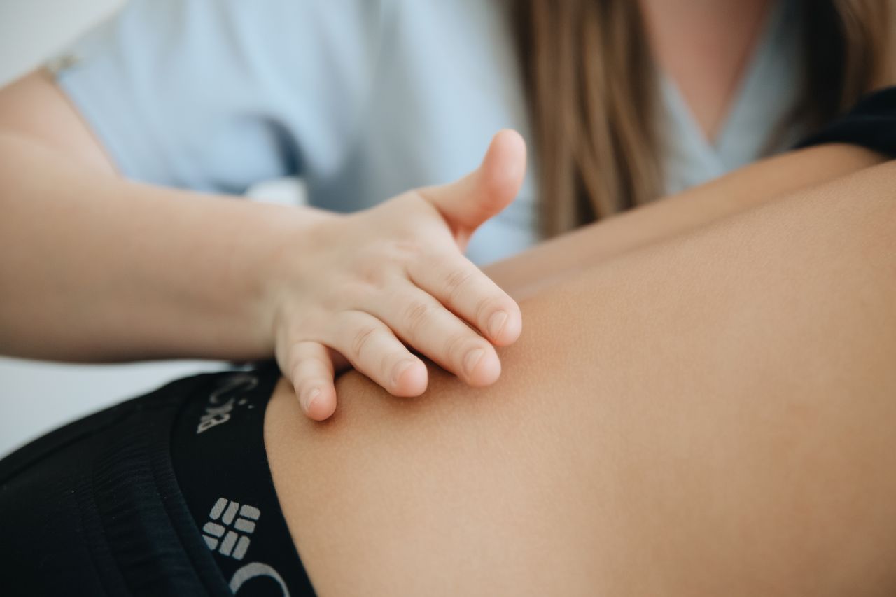 Crafting Captivating Headlines: Your awesome post title goes here Close-up of a physiotherapist providing a back massage to a patient in a clinic.